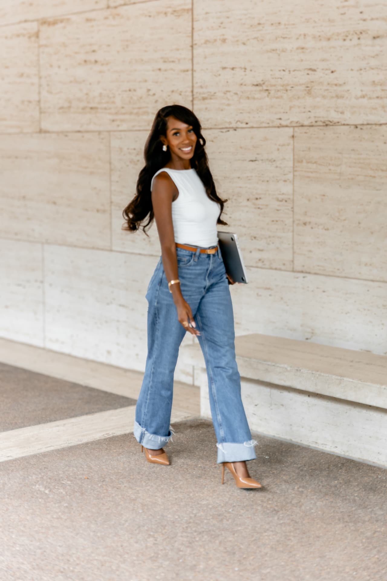 Courtney Washington stepping forward with her laptop